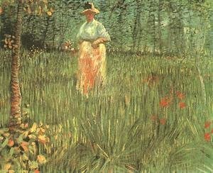 Woman Walking In A Garden A